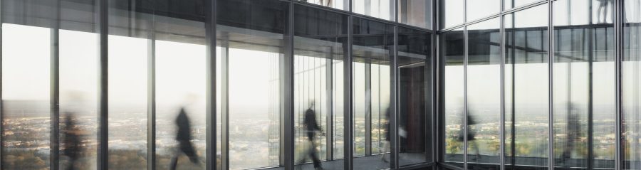 People walking on connecting bridges at Vienna Twin Towers
