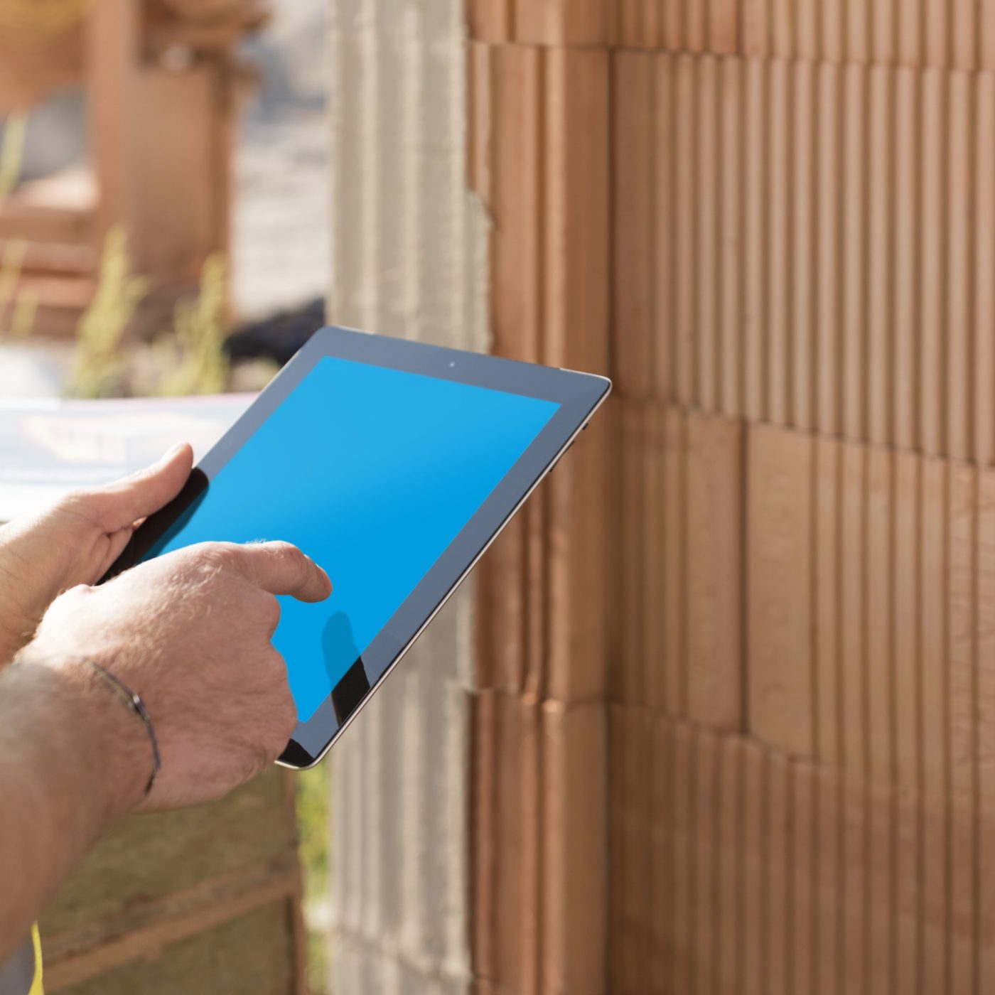 Construction worker with tablet computer